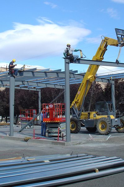 a construction workers working on a metal structure