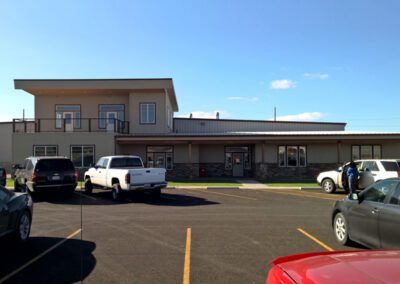 a building with cars parked in a parking lot