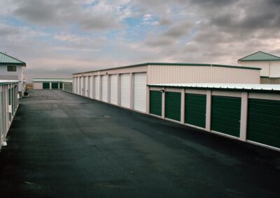 Green-doored storage units lined up in a row